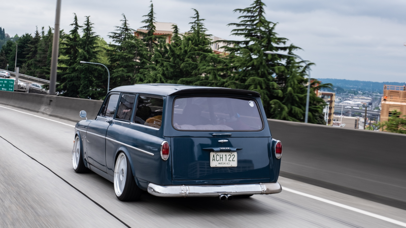 Illustration for article titled True Hero Swapped A Volvo Amazon Wagon Body Onto A BMW E30 In His Driveway